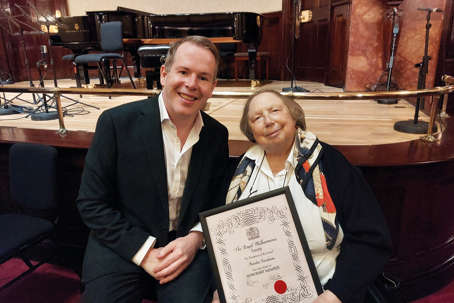 Amelia Freedman receiving Honorary Membership of the RPS at Wigmore Hall from the RPS’s Chief Executive James Murphy